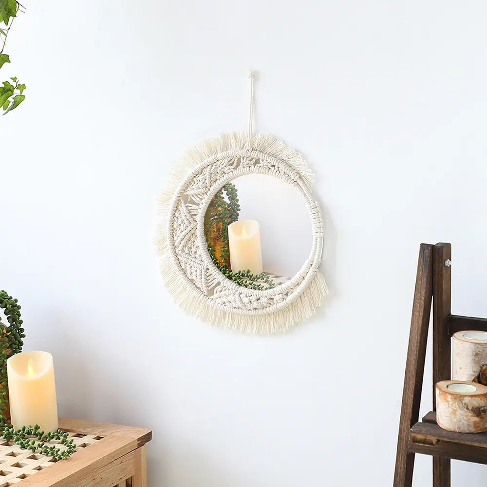Cream-colored macrame wall mirror with a circular frame and fringe designed for living room home decor.
