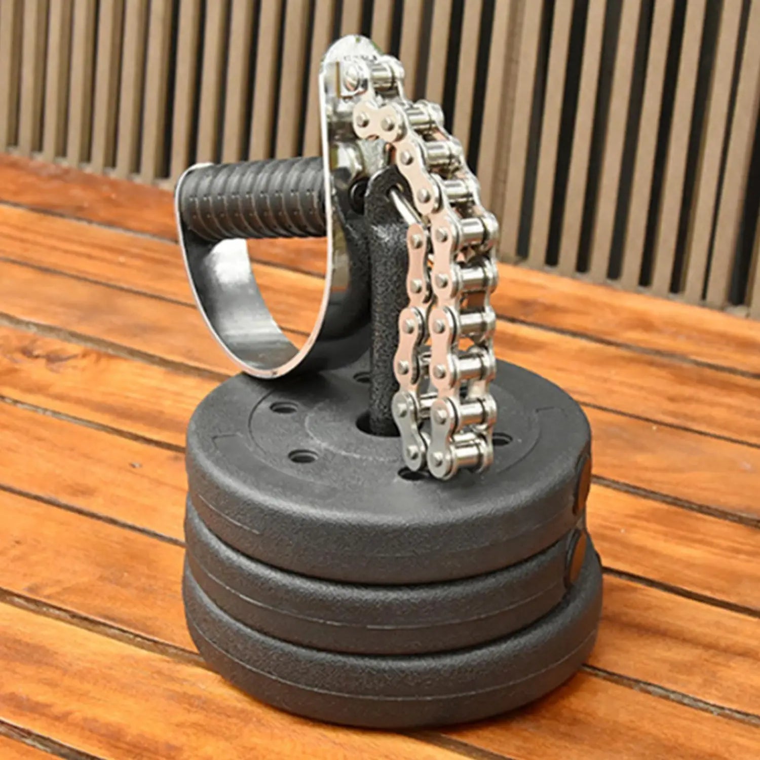 Silver chain hand gripper with black rubber grip and weight plates designed as arm wrestling training equipment forearm grip exerciser.