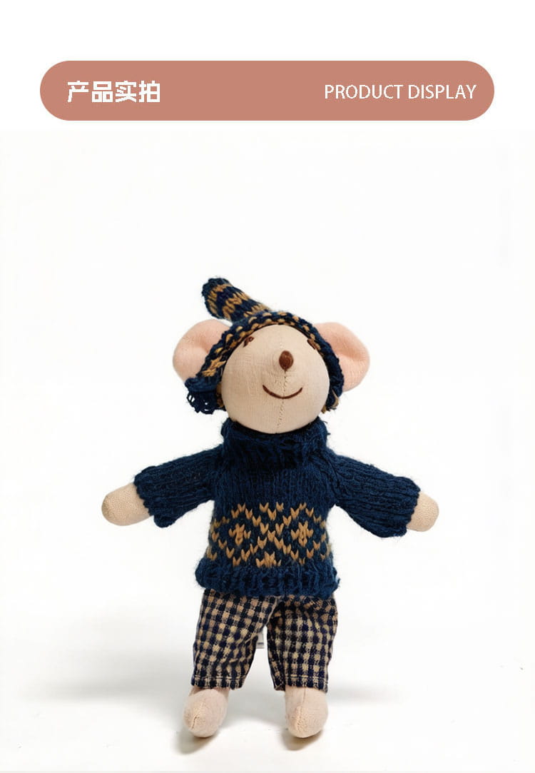 Adorable plush mouse doll dressed in a navy blue knitted sweater with gold geometric patterns, matching checkered pants, and a cozy knit hat.