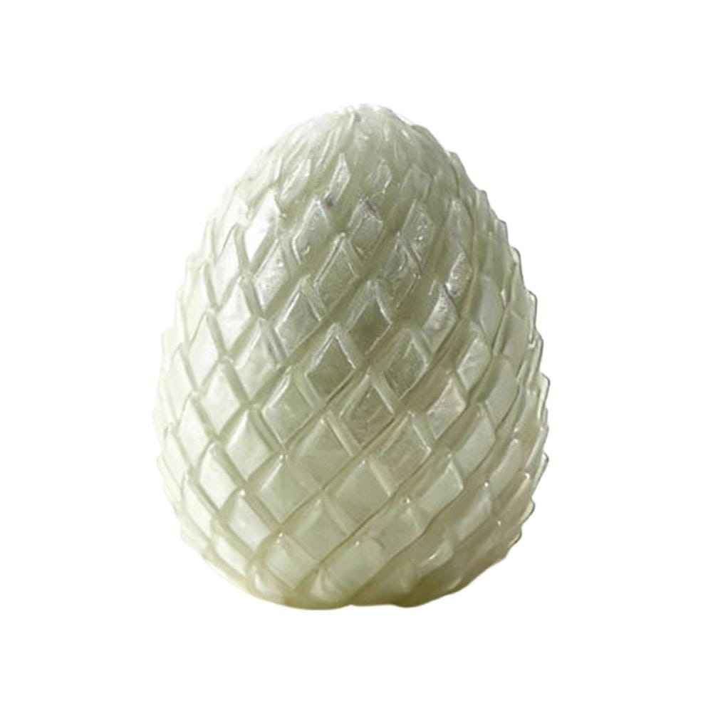 A translucent pale green articulated dragon egg fidget toy with a textured diamond-patterned surface viewed from the front.