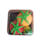 A clear plastic container holds colorful silicone tomato-shaped stress balls with green tops for stress relief use
