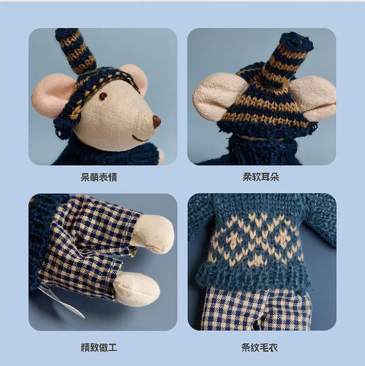A charming knitted plush mouse doll stuffed animal toy dressed in a navy and cream striped knit hat, matching sweater with diamond patterns, and blue and white gingham pants.