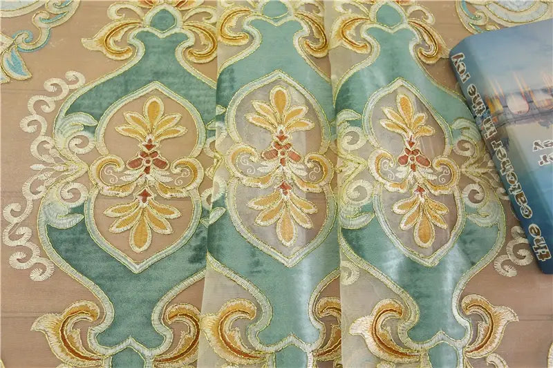 Elegant teal and gold embroidered damask curtain fabric with intricate floral patterns designed for living room french window curtains.
