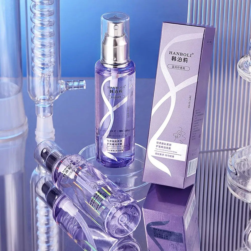 Purple glass essential oil spray bottle with silver pump and white swirling design by hanboli for hair care to apply proper treatment on dry frizzy hair.