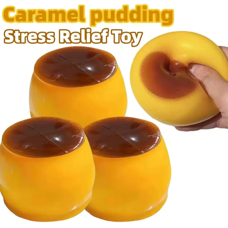 Yellow caramel pudding-shaped pudding squishy ASMR stress relief toy with a glossy stretchy texture and dark brown top resembling syrup.