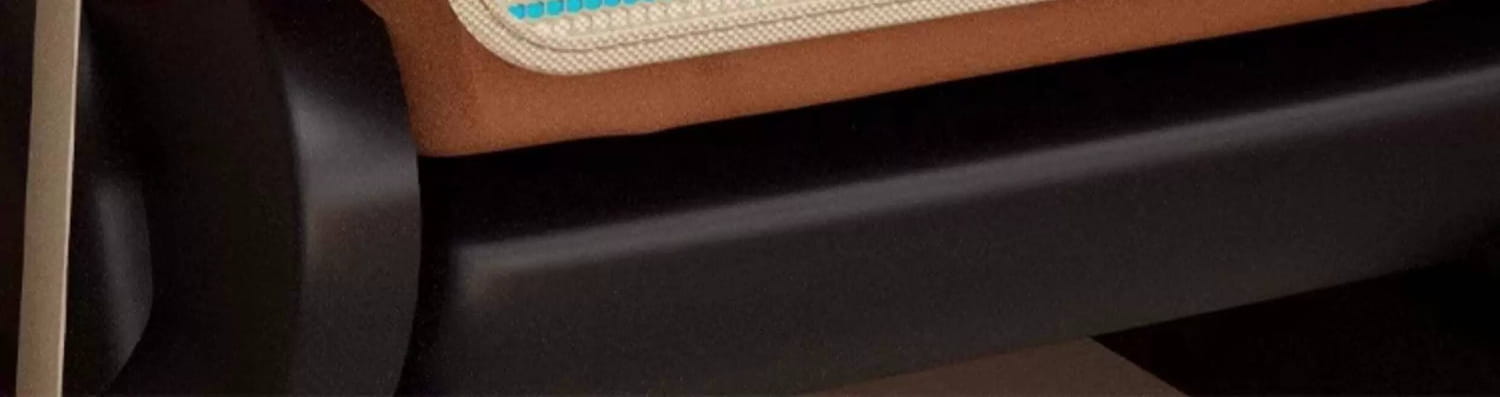 Tan leather cushion with beige mesh trim and light blue stitching along the edge on the car seat organizer animal alphabet storage pocket.