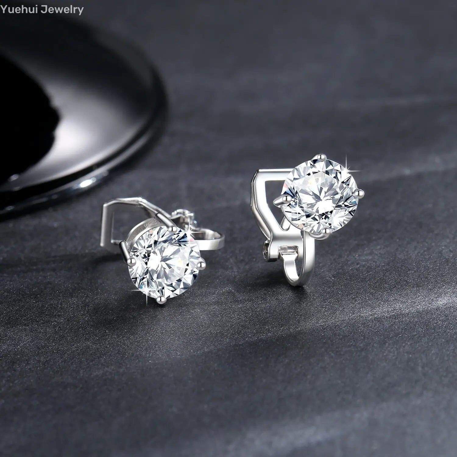 Silver stud moissanite clip on earrings featuring round sparkling clear stones set in 925 sterling silver with a sleek minimalist design.