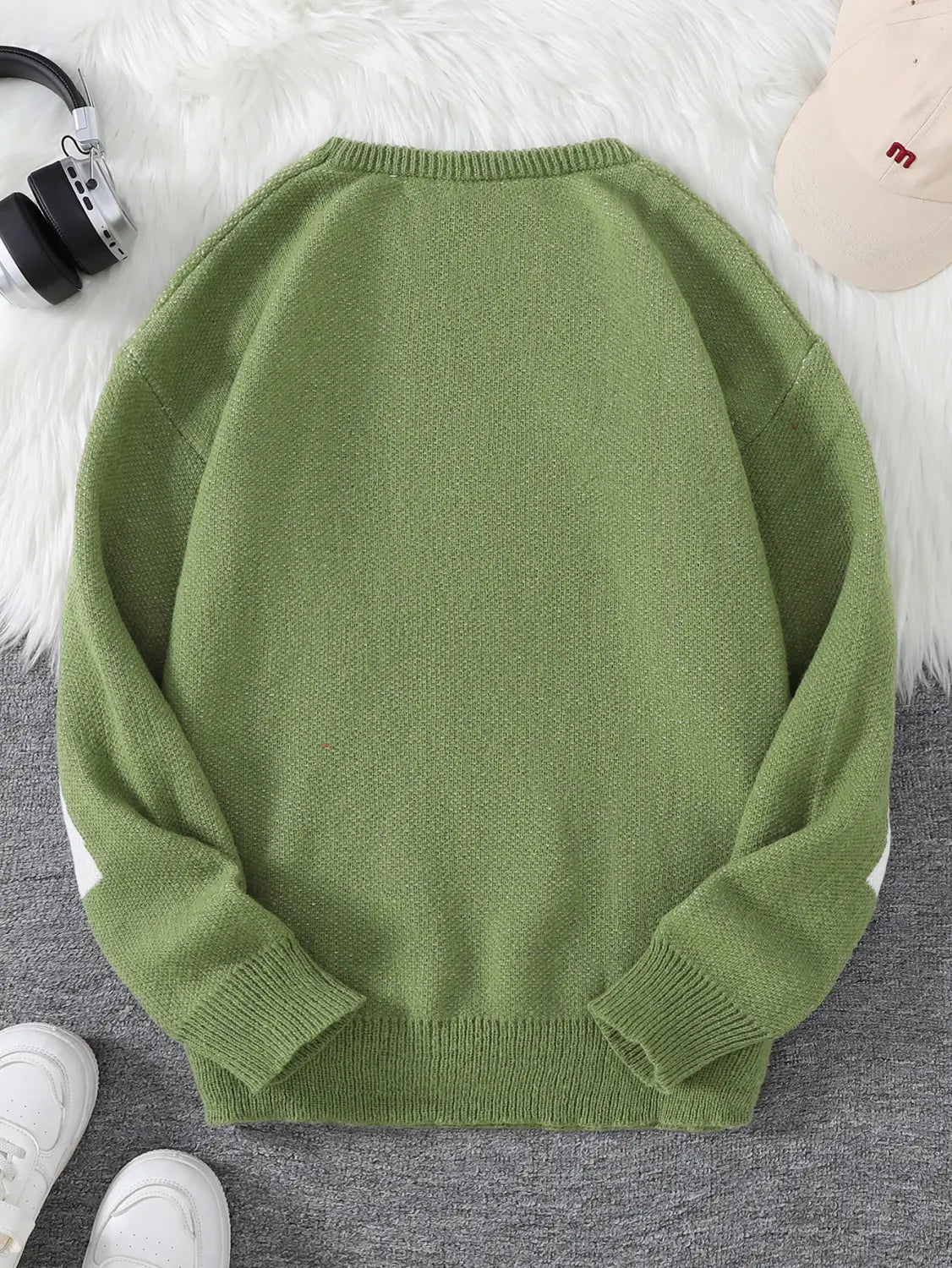 Men black amazing graphic knit sweater in soft olive green knit with ribbed cuffs and hem featuring subtle white panels on the sleeves.