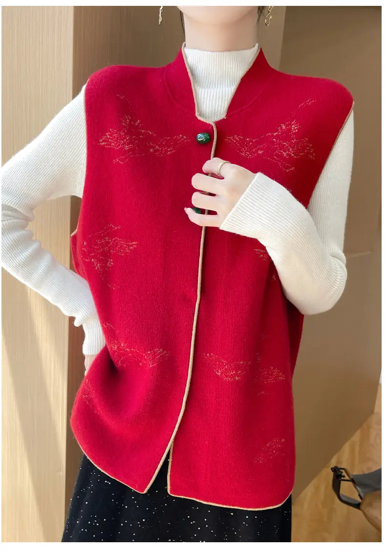 Wool embroidered vest women in red knitted fabric with subtle floral embroidery and light-colored trim along the edges.