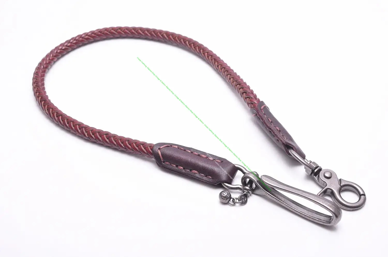 A braided burgundy leather phone strap with a dark brown leather tab and silver-toned metal hardware for a leather biker wallet chain punk jeans accessory.