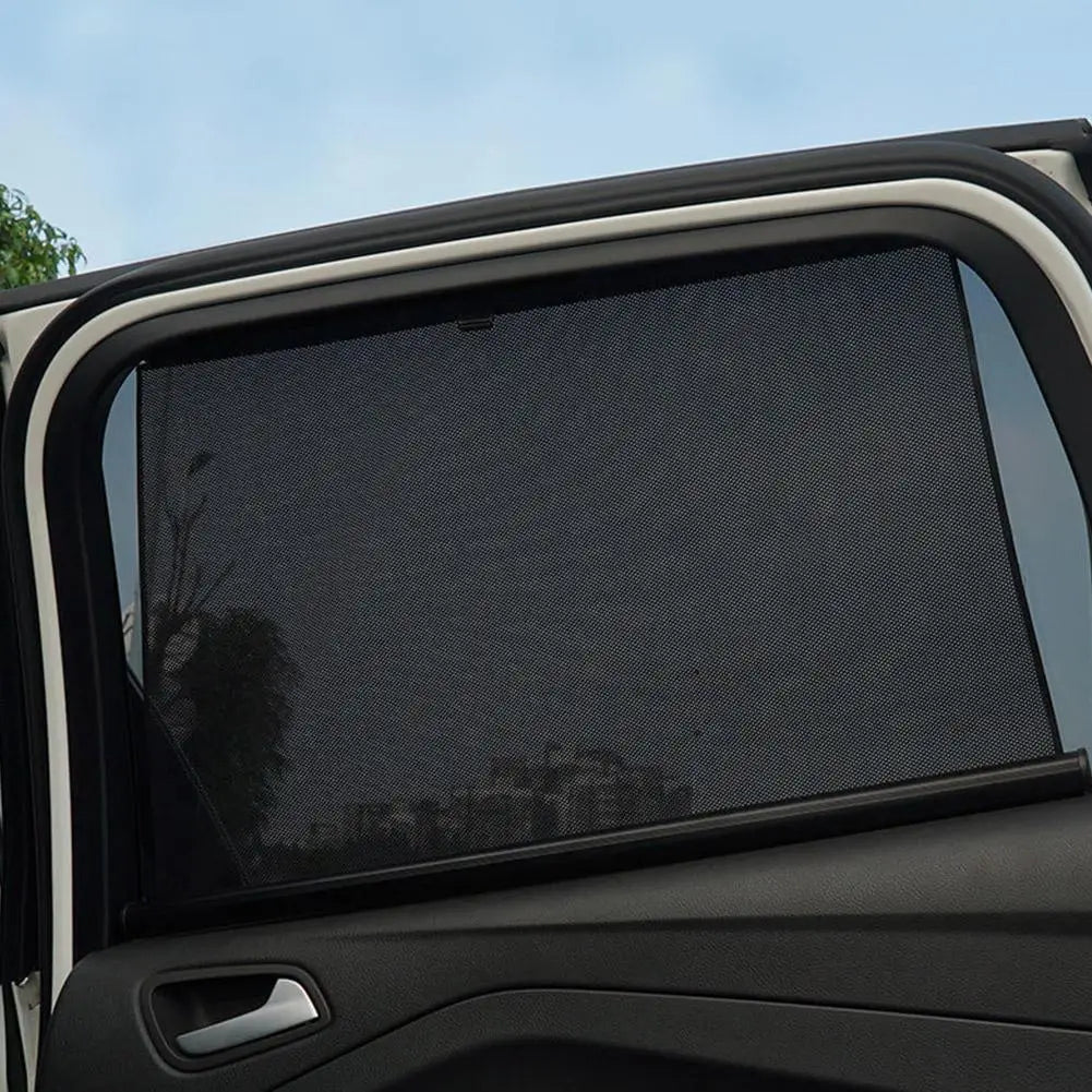 Black mesh retractable car window sunshade with uv protection and sleek flexible design.