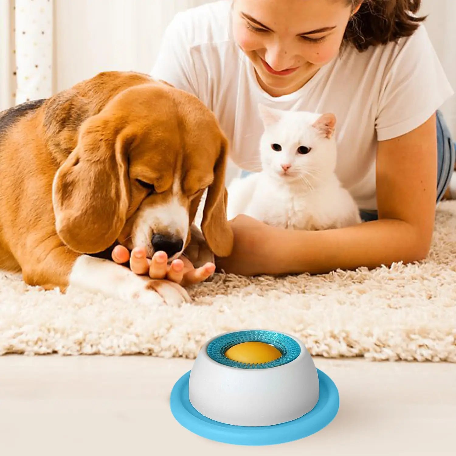 Blue and white interactive dog licking toy with textured circular top and yellow center designed as a slow feeder puzzle for puppies