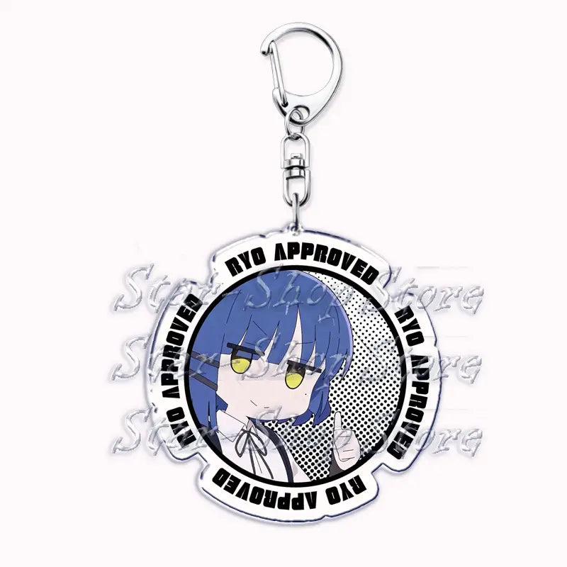 Clear acrylic keychain featuring a chibi-style anime character with blue hair and yellow eyes encircled by black text ryo approved from the anime character acrylic keychain Bocchi the Rock.