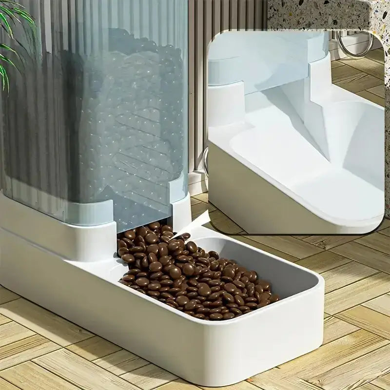 White plastic gravity pet feeder with transparent vertical compartment filled with dark brown pellets and white tray below for food storage in water dispenser and gravity pet feeder set.