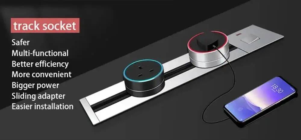 Silver track socket with two circular power outlets in black and silver each featuring a glowing LED ring around the edge for the embedded wireless desktop charger 15w.
