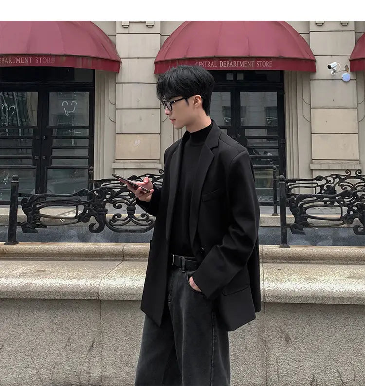 Blazer de poliéster oversize negra con ajuste relajado y hombros estructurados para chaqueta de traje de doble botonadura casual para hombre.