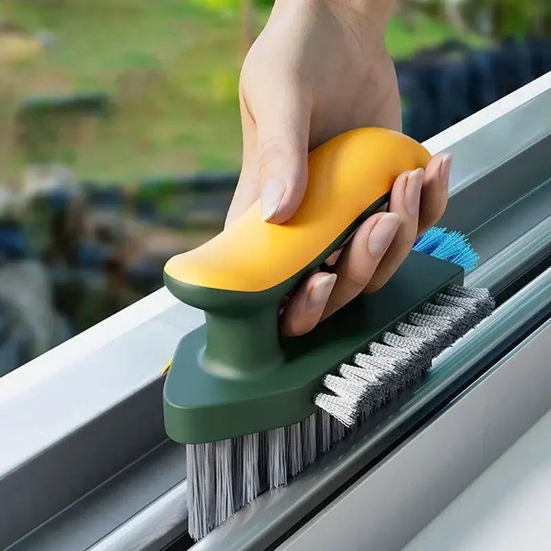 Brosse de nettoyage en forme de V pour carrelage et rainures jaune et verte, avec des poils à double face pour un nettoyage efficace des vitres.