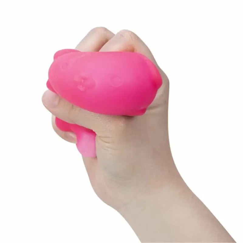 a bright pink pig-shaped squishy sensory fidget toy displayed from the front with a quick rebound feature