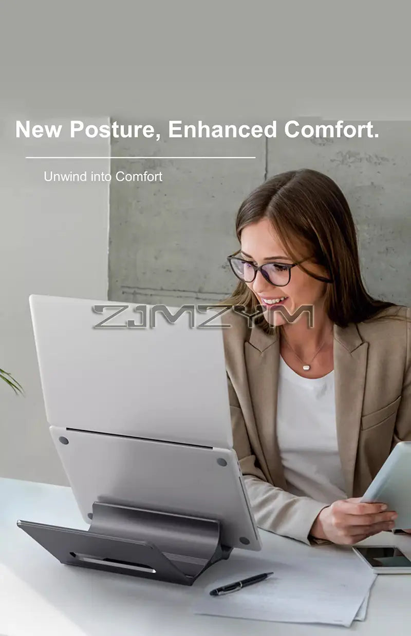 Silver aluminum laptop stand with a sleek minimalist design and adjustable angles for ergonomic support on a desk holder.