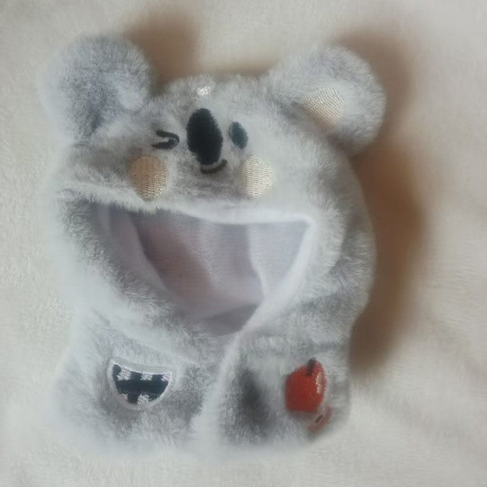 A soft gray plush koala hat with embroidered black eyes tan cheeks and a red apple patch on the side for a plush doll headgear animal costume 10cm.