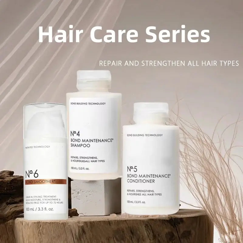 white cylindrical bottles with minimalist labels from the hair care series bond maintenance line featuring control frizz repair split ends shampoo and conditioner