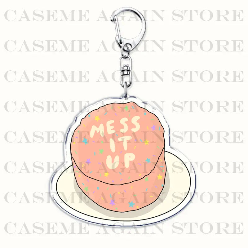 A pink cake-themed acrylic keychain with colorful sprinkles and mess it up text designed as a Gracie Abrams anime fan gift.
