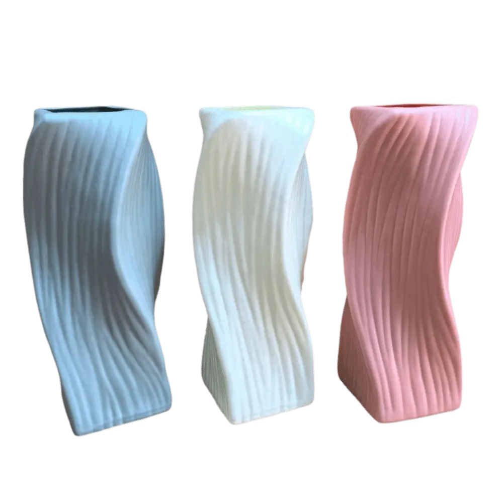 Three modern twisted ceramic Nordic Wave plastic flower vases in pastel blue white and pink with vertical ribbed texture for aesthetic home decor.