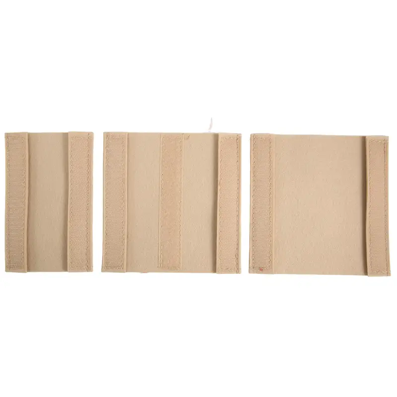 Beige fabric strap adjusters with stitched edges and elastic sides on the felt baby diaper caddy nursery storage basket.