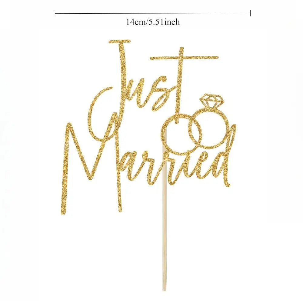 gold glitter just married cake topper featuring intertwined rings and diamond engagement ring design for wedding decoration
