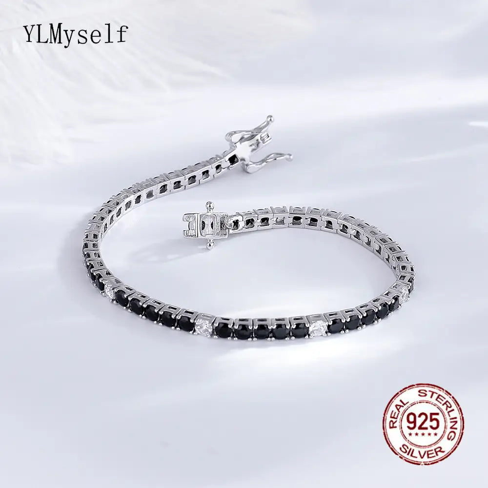 Sterling silver black cz tennis bracelet 3mm featuring alternating black and clear cubic zirconia stones set in a polished 925 sterling silver band with an elegant clasp.