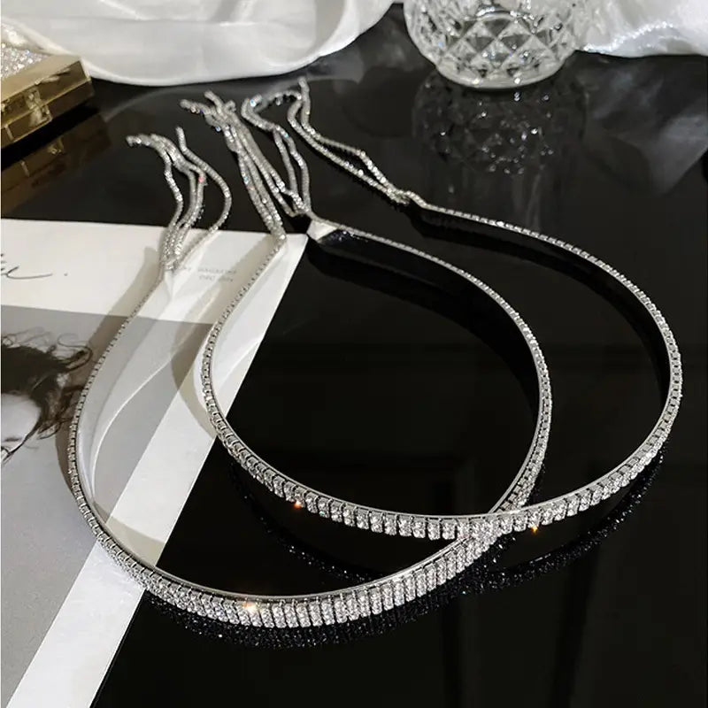 Silver rhinestone-embellished headband for women featuring dangling crystal tassels.