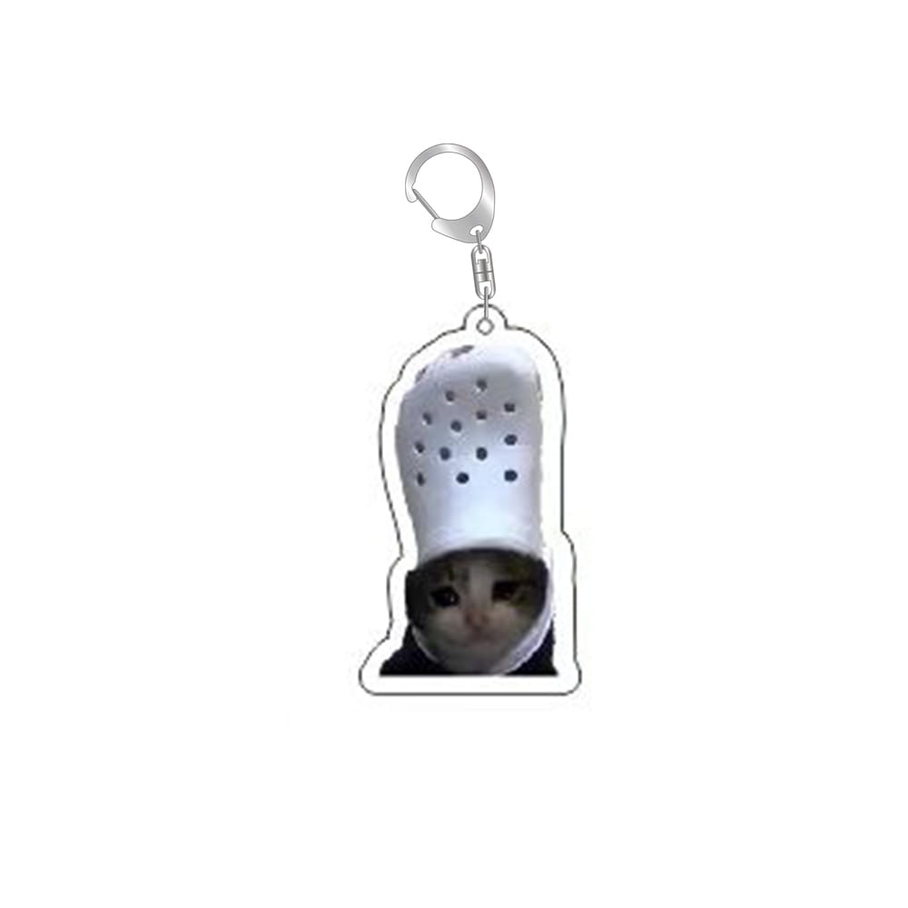 White acrylic cat meme keychain shaped like a croc with a cat’s face peeking out from underneath.