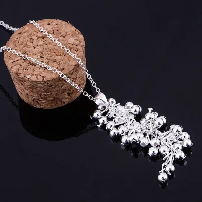 Silver chain necklace featuring a cascading cluster of shiny spherical beads in 925 silver grape bead jewelry set.