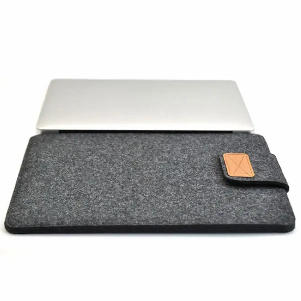 dark gray felt laptop bag sleeve for macbook air featuring a tan leather patch with an x shaped design suitable as a tablet bag alternative