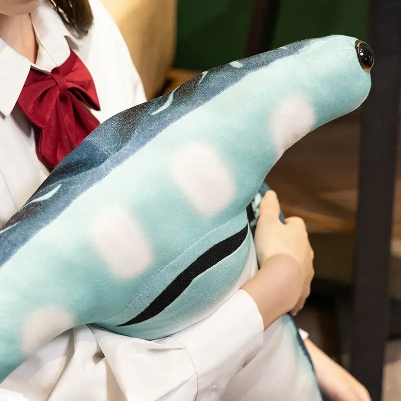 a plush light blue hammerhead shark plush pillow soft toy with white and black patterned details designed for comfort and decor