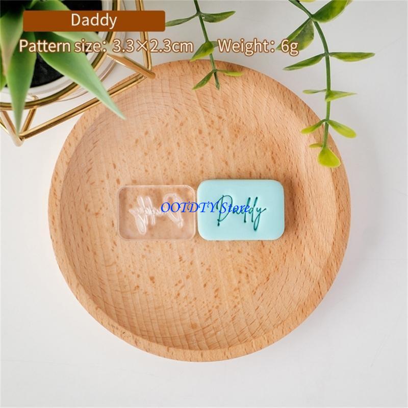 Light blue rectangular soap with daddy engraved in cursive script created using a Father’s Day cookie cutter and fondant stamp.