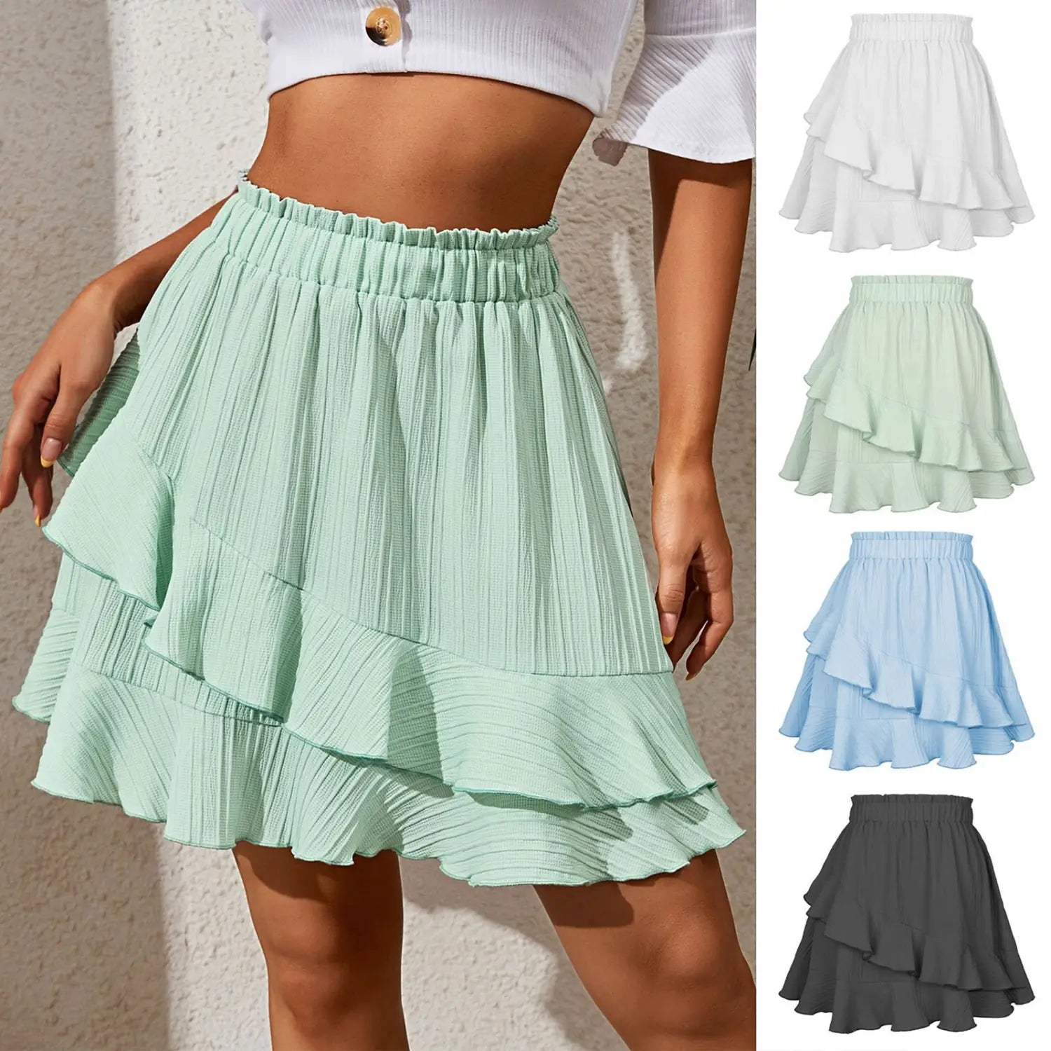 A mint green high waist ruffle mini skirt with tiered pleats and an elastic waistband.