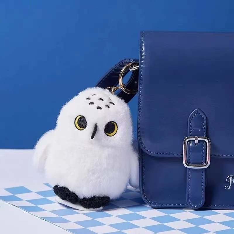 fluffy white owl plush toy keychain with yellow eyes black beak and soft plush texture