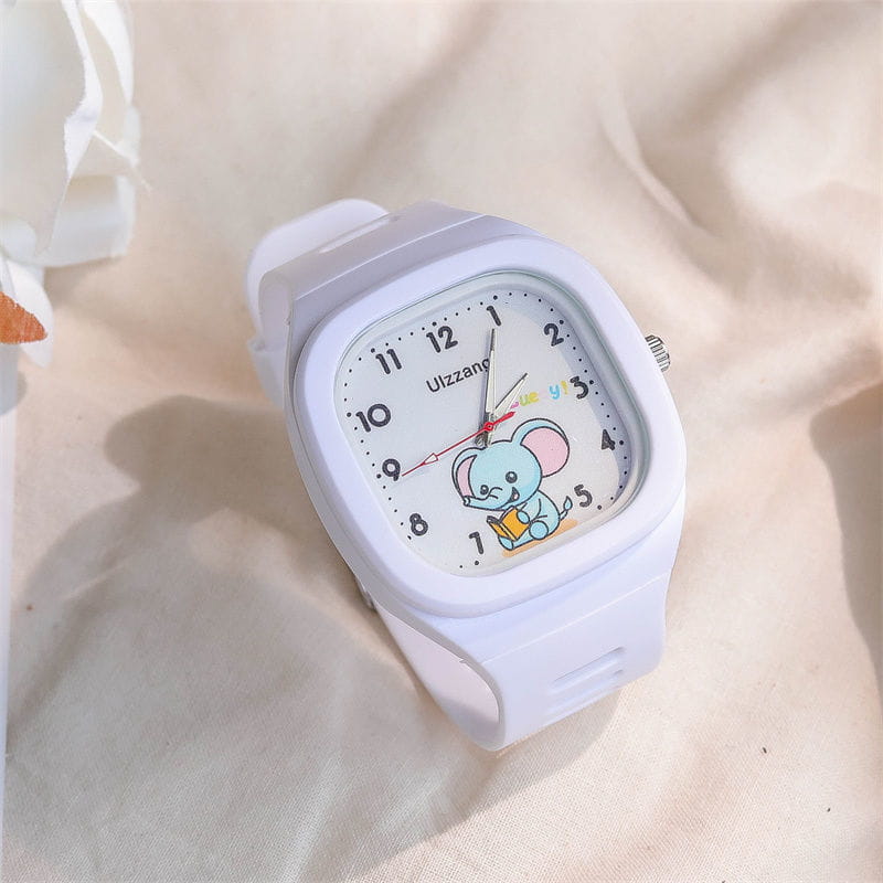 Kids luminous cartoon elephant digital watch in white featuring a light blue elephant holding a book on the rectangular face.