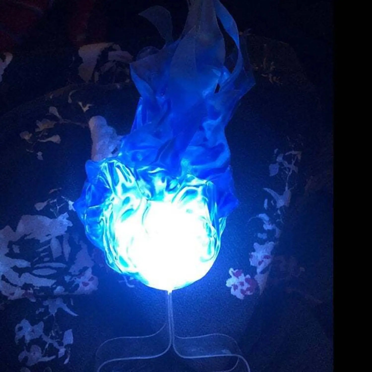 A floating fireball led Halloween prop lamp shaped like a glowing blue flame with a translucent fiery design and a bright white center.