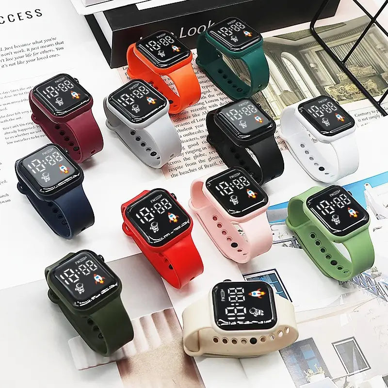 Une collection de montres électroniques colorées pour enfants, garçons et filles, avec bracelets en silicone et affichages numériques LED de type sport à thème spatial