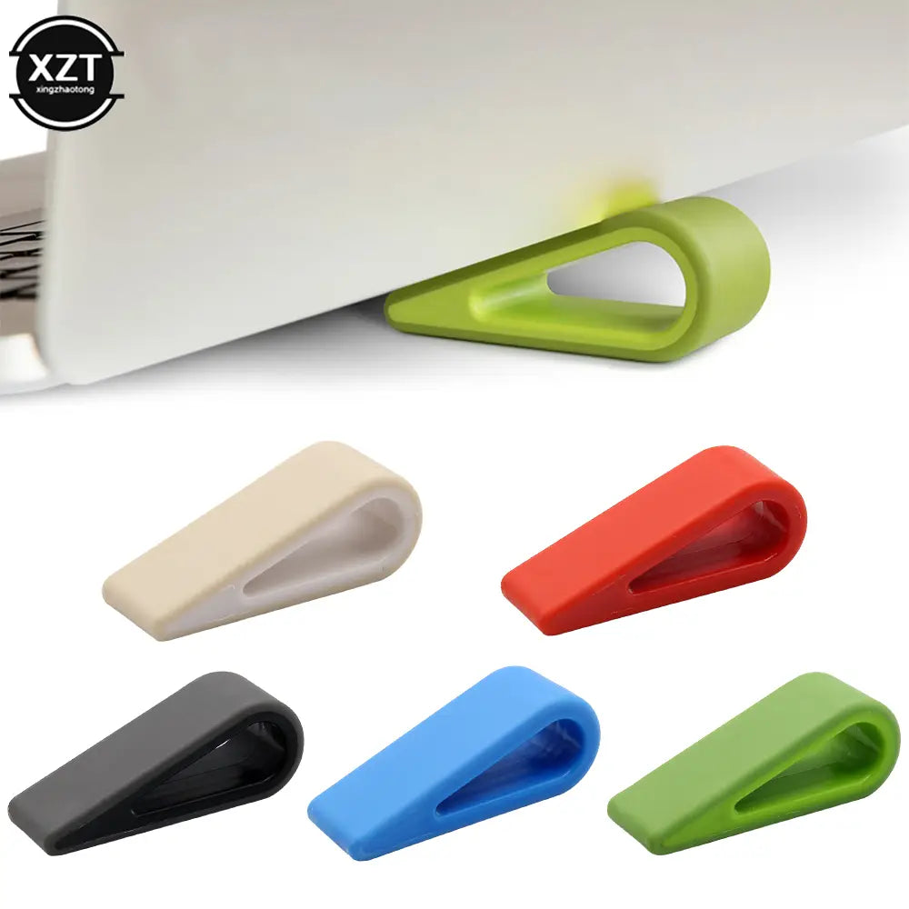Tope para puerta de silicona verde lima con un diseño flexible y suave utilizado como accesorio de base de enfriador ergonómico ajustable para soporte de laptop.