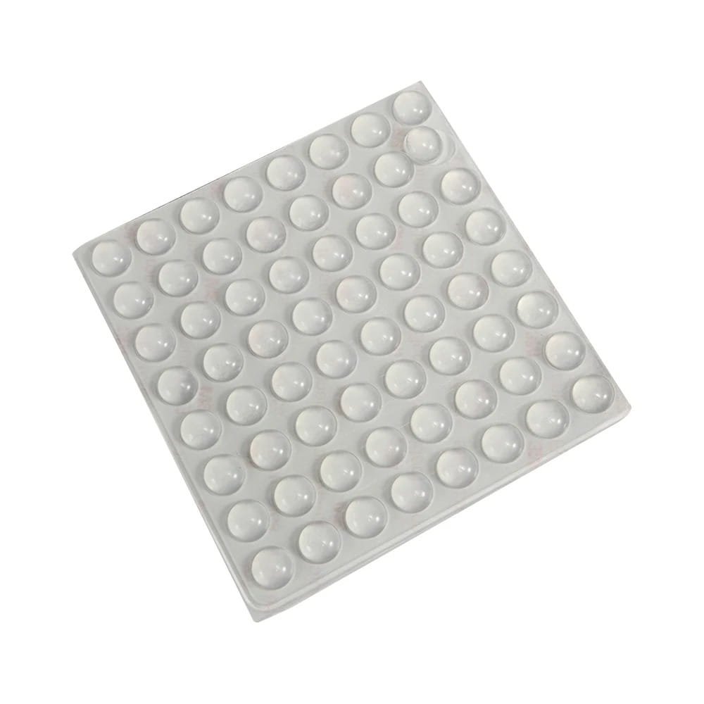 Pare-chocs d’armoire en silicone blanc, lot de 100, montrant en gros plan un patin antidérapant avec une grille de bosses circulaires en relief, conçu pour empêcher le glissement et protéger les surfaces
