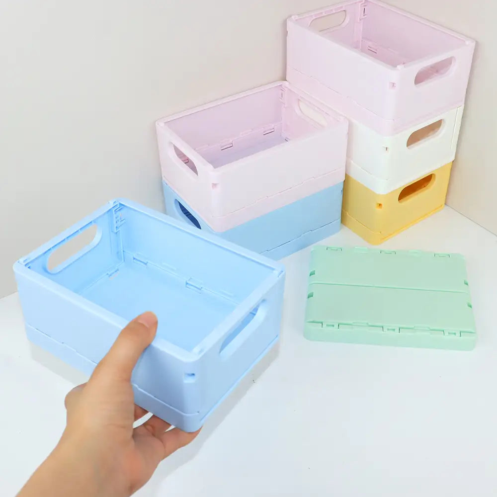pastellblaue faltbare Kunststoff-Aufbewahrungsbox mit integrierten Griffen, ausgelegt als Desktop-Organizer und Aufbewahrungsboxen-Körbchen zum Falten.