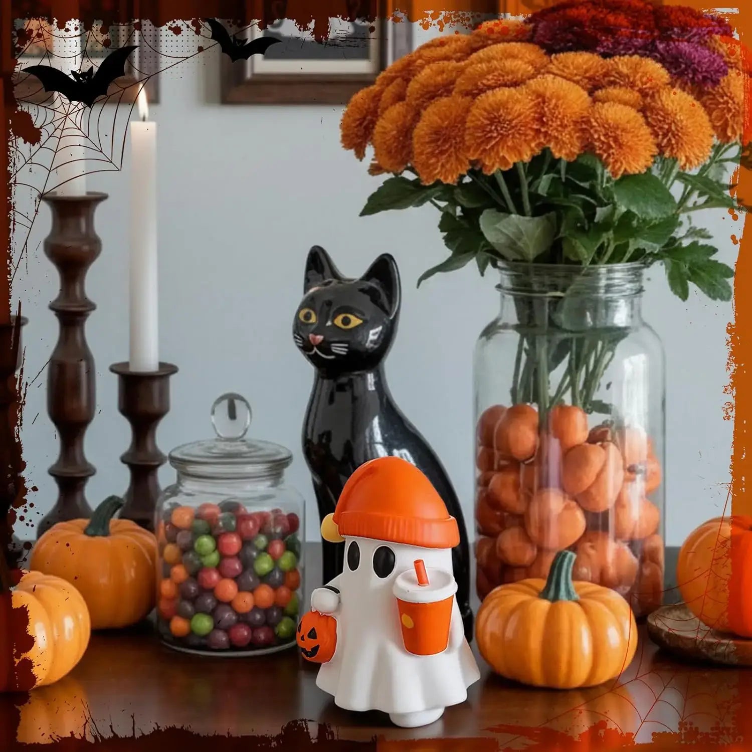 Cute resin ghost figurine made of white ceramic wearing an orange hat and holding a pumpkin drink cup.