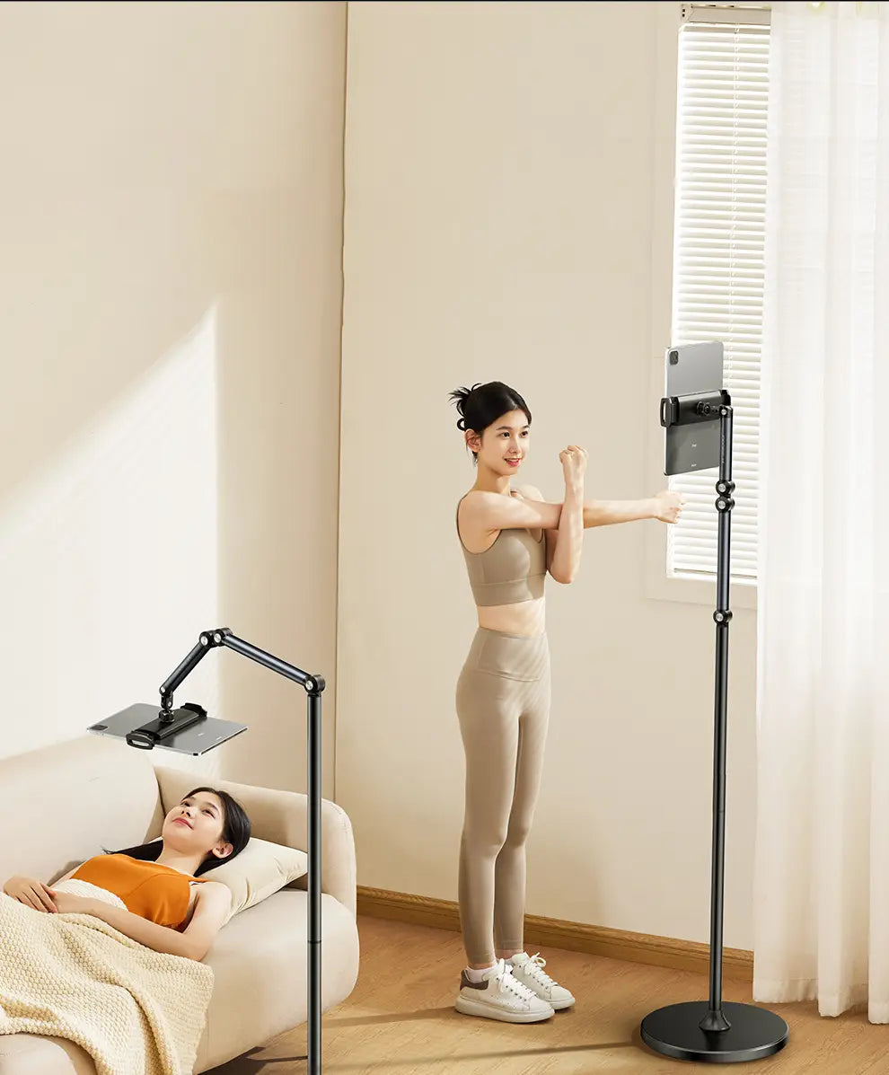 Black adjustable standing tablet stand with circular base and articulated arm made of aluminum alloy for tablet and phone floor use.