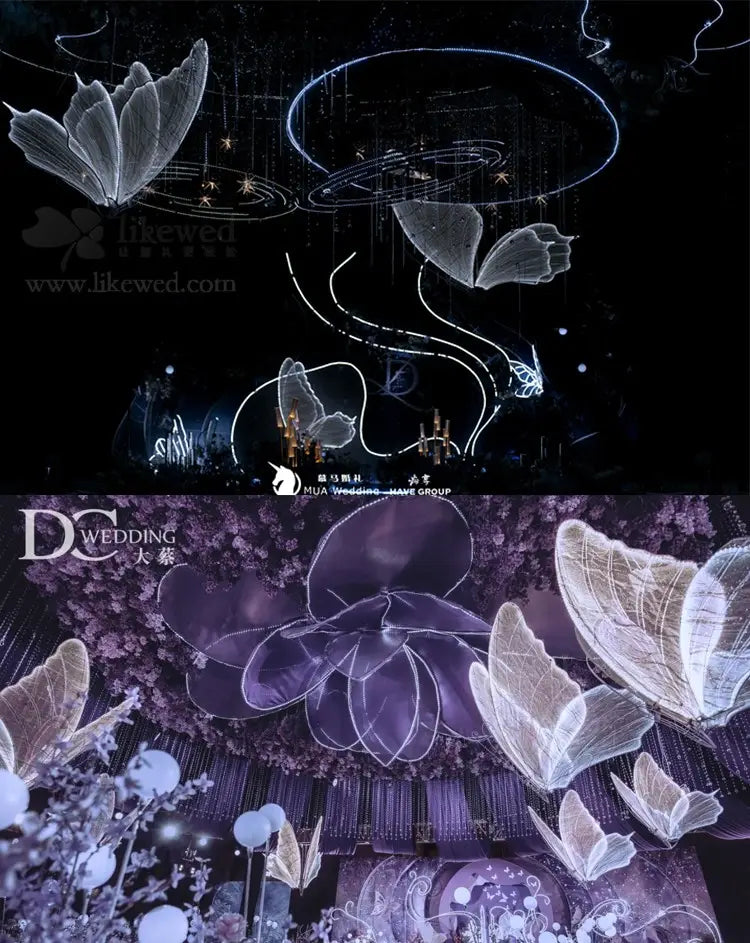 Leuchtende Schmetterlingsflügel, hängende Hochzeitstennenlichtanlage, mit beleuchteten Schmetterlingsskulpturen aus durchscheinendem Weiß und tiefem Violett in einem Drahtgittermaterial sowie leuchtender LED-Beleuchtung.