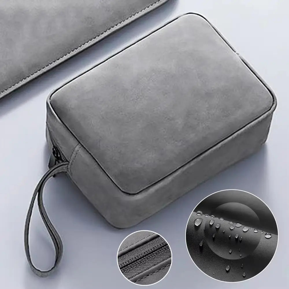 Graue, wie Wildleder wirkende elektronische Zubehör-Reiseorganizer-Tasche mit Handgurt und wasserabweisender Oberfläche aus PU-Leder.