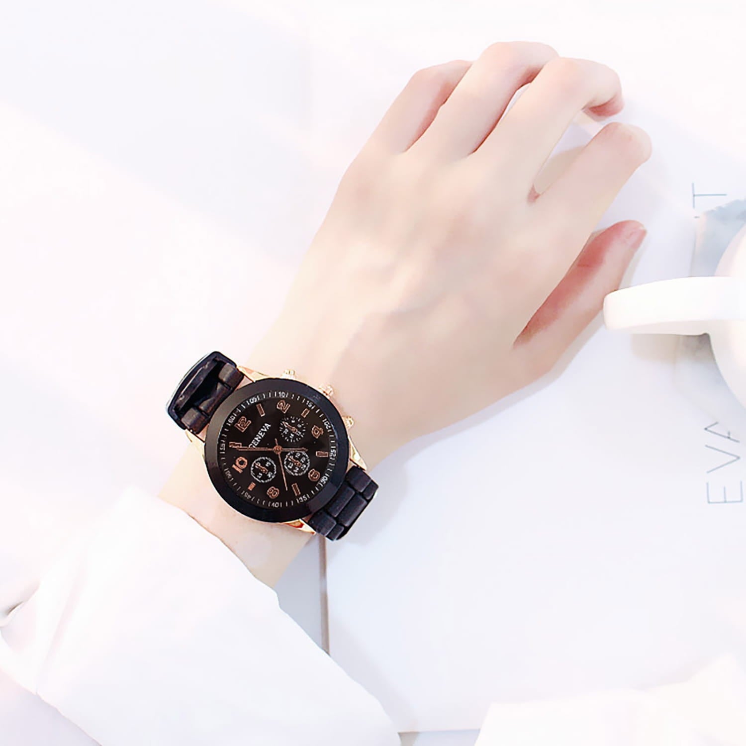 Black leather strap women silicone quartz watch with a rose gold-tone case and black dial featuring multiple subdials for fashion chronograph use.