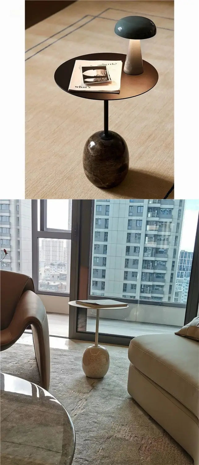 Dark bronze minimalist marble metal round side table with a single black metal leg and textured spherical base.